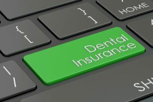 keyboard with green dental insurance key